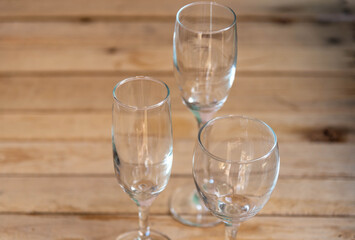 Glass bowls on aged wooden background