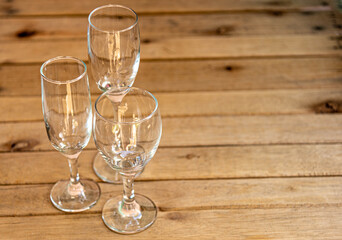Glass bowls on aged wooden background