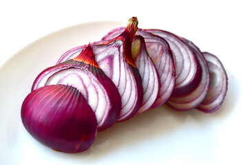 Sliced blue onion on a white plate close-up