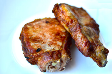 A piece of roast pork on a white background