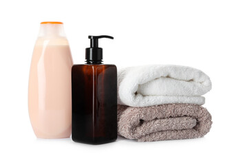 Personal hygiene products and towels on white background