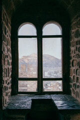 Obraz premium Old castle window overlooking the fortress, middle ages