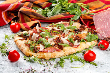 Roman pizza.  Carbonara pinza with bacon, arugula and chanterelles