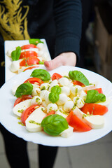 serving salad. Creation of an author's salad in a restaurant 
