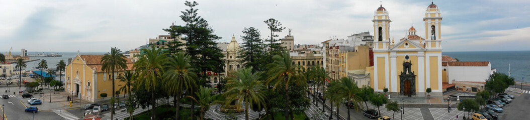 Fototapeta na wymiar Ceuta, Spain - April 19, 2014: Vista panoramica de la plaza de Africa situada entre la catedral y la iglesia de la Virgen de africa. Al fondo ponemos ver el ayuntamiento.