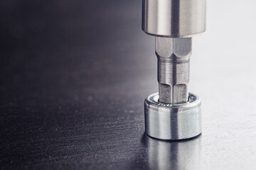 Hex drill bit screw hex bolt in metal steel plate. Spanner, bolt, screw and nuts.