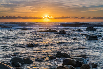 Sunrise seascape in the rocky alcove