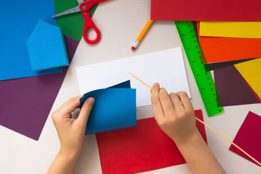 Girl Kid makes Baby Girl makes Crafts from Colored Paper and Sponge Crafts from Colored Paper and Sponge