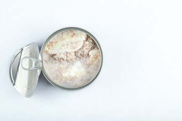Top view of open canned beef on white background