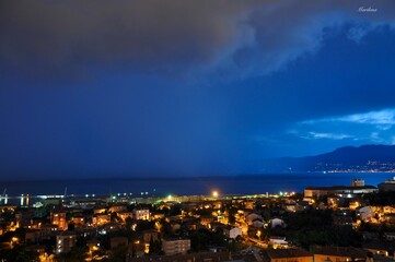 Storm clouds and rain over Rijeka city Croatia with a piece of sky
