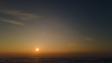 sunset over a winter Russian village in the Penza region