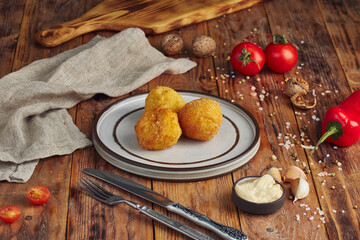 Fried minced meat (meat cutlet) on a plate, wooden background