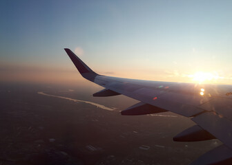 View from a airplane window on the beautiful sunset sky