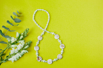 shape figure of eight 8 number on yellow paper background with white flowers. International Women's Day card. womans independence dayand spring floral concept