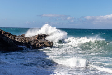 Fototapeta premium Ocean view on Ajuí beach. Beautiful view of the clear sea, waves, cliffs and beach in Playa de Ajuí - Canary Islands, Fuerteventura, Spain. 