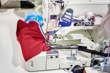 Spools of thread and sewing coverstitch machine