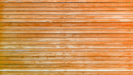 Old background of orange wooden planks board texture.