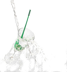 Water falling on a glass cup with green mixer