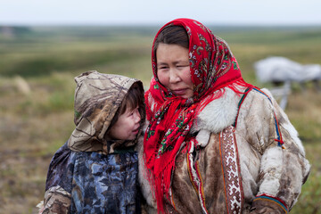 The extreme north, Yamal, the past of Nenets people, the dwelling of the peoples of the north, a family photo near the yurt in the tundra
