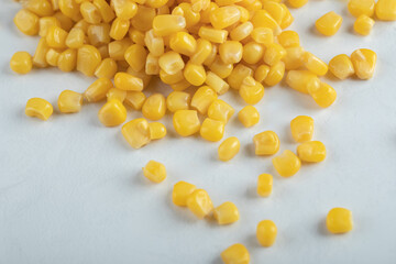 Close up photo of marinated corn seeds on white background