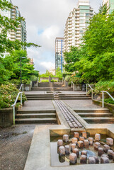 Modern Apartment Buildings with flowers and water landscape in Vancouver, British Columbia, Canada.