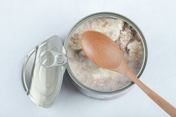 Top view of open can, canned beef on white background