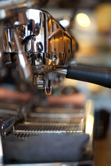 closeup of holder with handle in professional espresso coffee machine group head