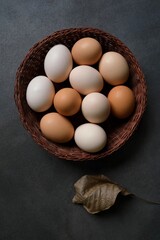 Colorful eggs on dark background. Easter eggs. View from the top.