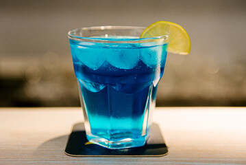 Making a delicious colored cocktail with lime and mint