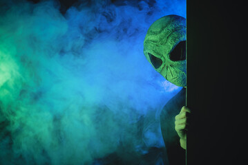 The alien is looking out from a wall concept.