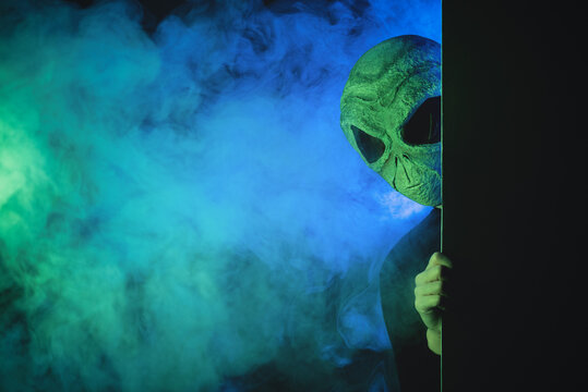 The alien is looking out from a wall concept.