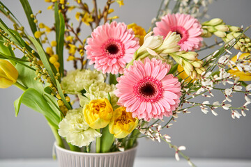 Finished flower arrangement in kenzan a vase for home. Flowers bunch, set for interior. Fresh cut flowers for decoration home. European floral shop. Delivery fresh cut flower.
