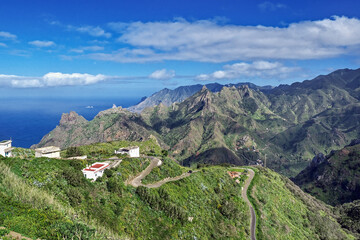 Obraz premium View over the Anaga mountains and the Atlantic from Taborno (Tenerife Island) Great view over the Anaga mountains on Tenerife, from the Mirador del Fuente in Taborno. Above that blue sky with small wh