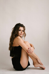 Portrait of a beautiful young sexy girl woman in a studio on a white background