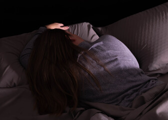 A woman in bed sleeping inn