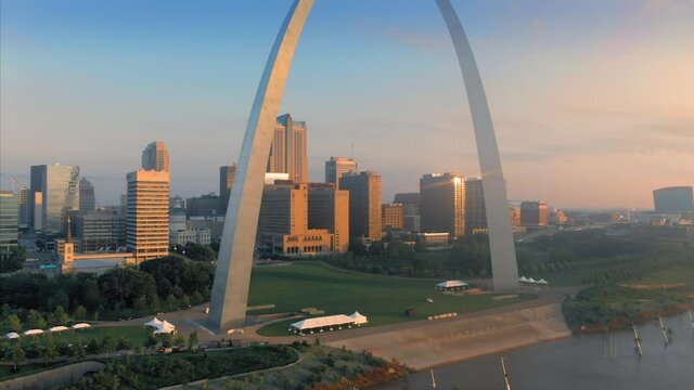 Aerial: The Gateway Arch, Mississippi River & downtown St Louis at sunrise. Missouri, USA