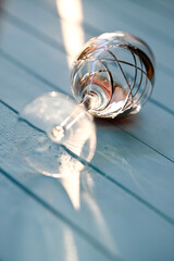 glass of red wine on blue wooden table background.