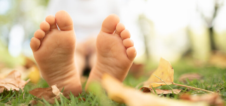 Closeup of feet relaxing in the grass. 