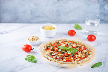 Millet pine nuts Chia seeds pizza crust with tomato; red bell pepper, onion and basil