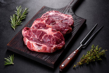 Fresh raw beef meat to make delicious juicy steak with spices and herbs