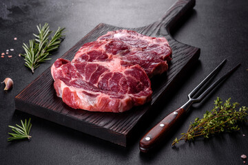 Fresh raw beef meat to make delicious juicy steak with spices and herbs