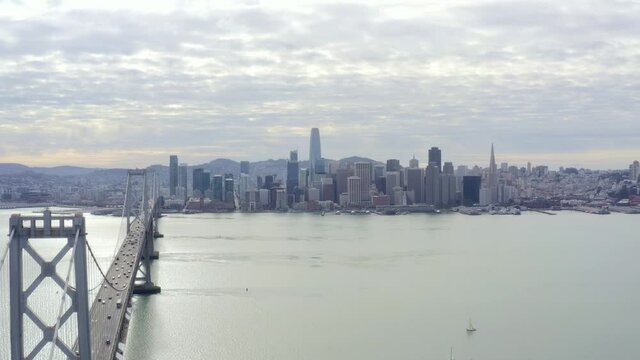 Aerial: cityscape and a bridge, drone view