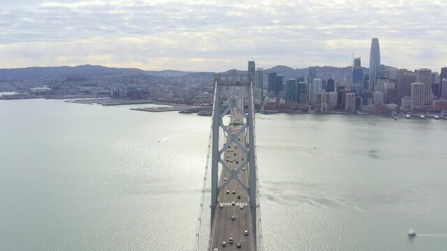 Aerial: bridge over the sea in the city, drone view