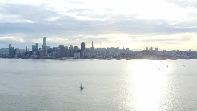 Aerial: city skyline cloudy, drone view