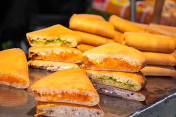 Street food market in Asia. Sandwiches with different fillings on the counter