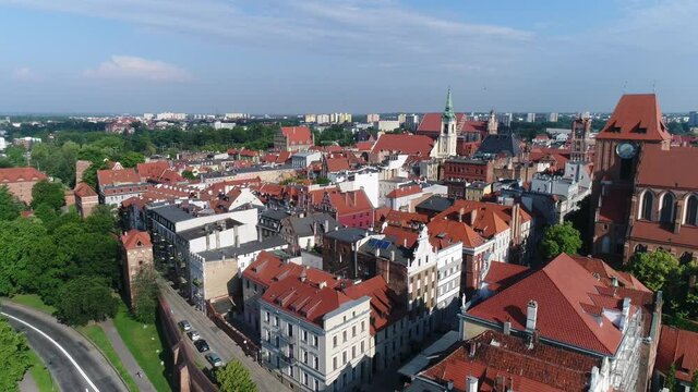 View of the old town in Toruń from the Vistula River, Atmospheric tenement houses with red roofs. In the distance you can see the Old Town Square.