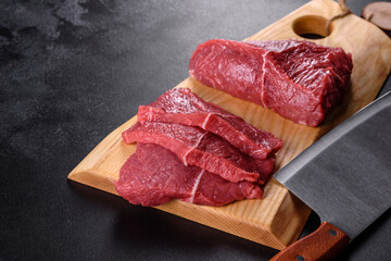 Fresh raw beef meat to make delicious juicy steak with spices and herbs