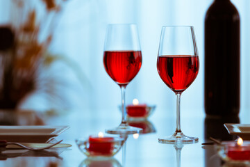 two glasses of red wine on the table