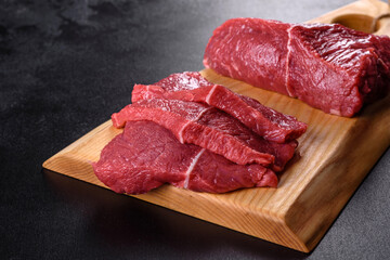 Fresh raw beef meat to make delicious juicy steak with spices and herbs