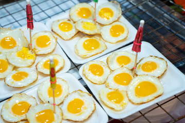 street food in Thailand. Fried eggs. Scrambled eggs for take away